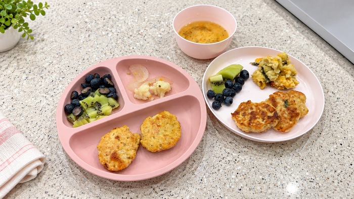 Chicken tofu veggie nuggets served with colorful vegetables on two kid-friendly plates